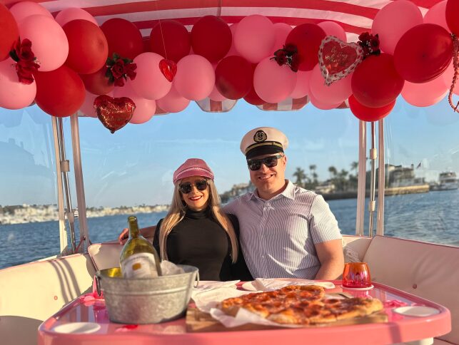 Valentine couple with pizza and champagne
