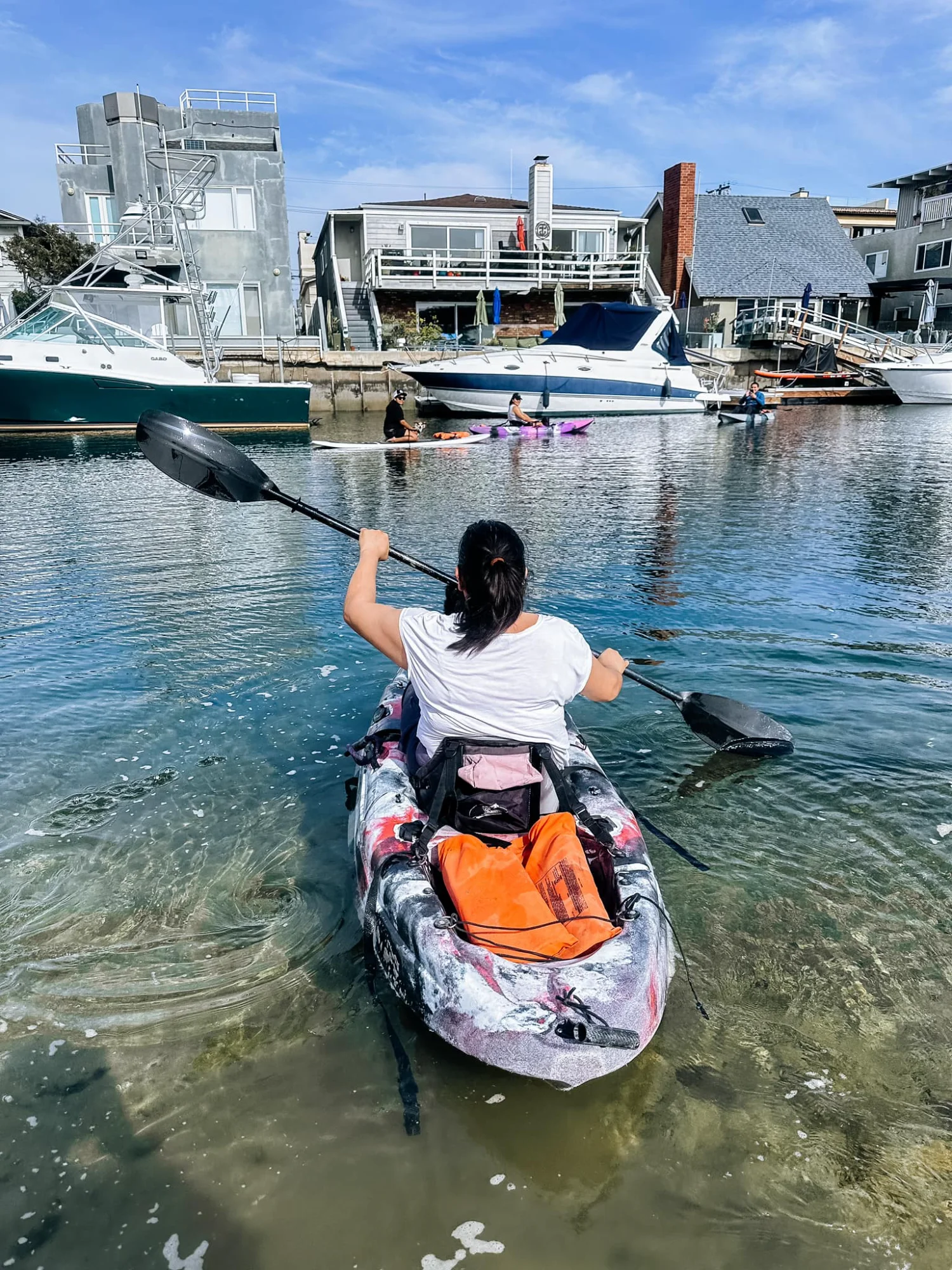 Solo kayaker departing