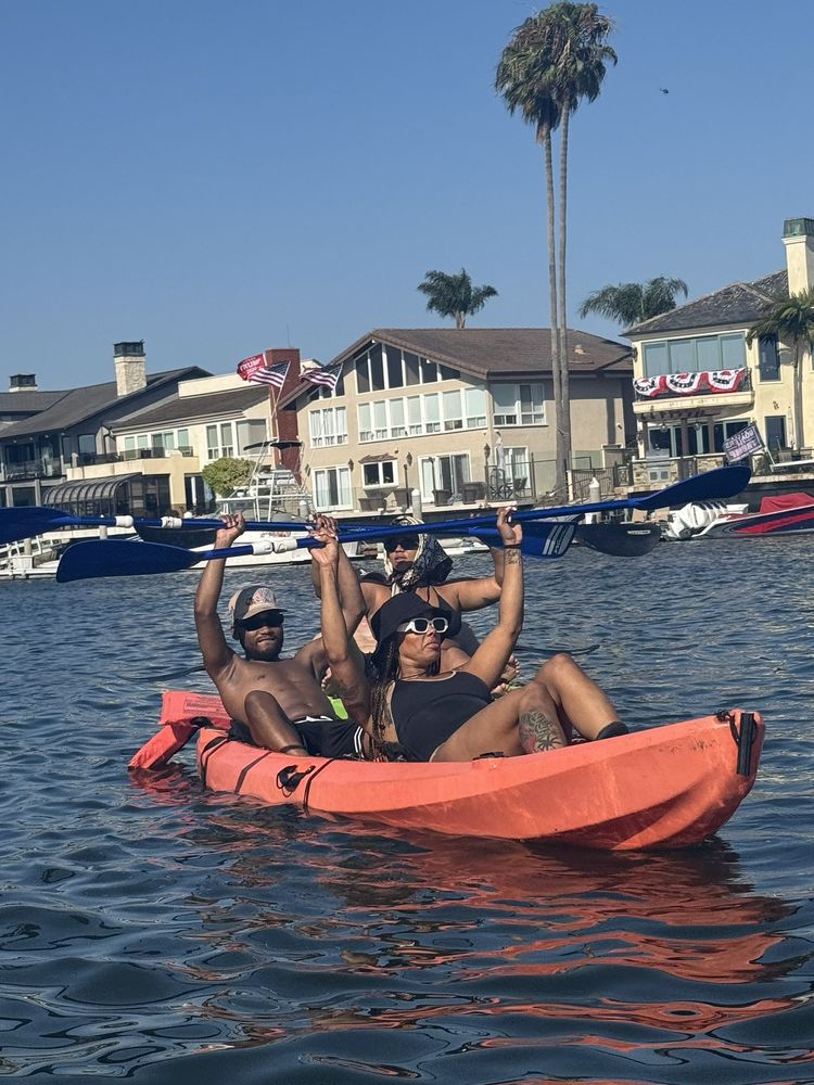 Tandem kayakers celebrating